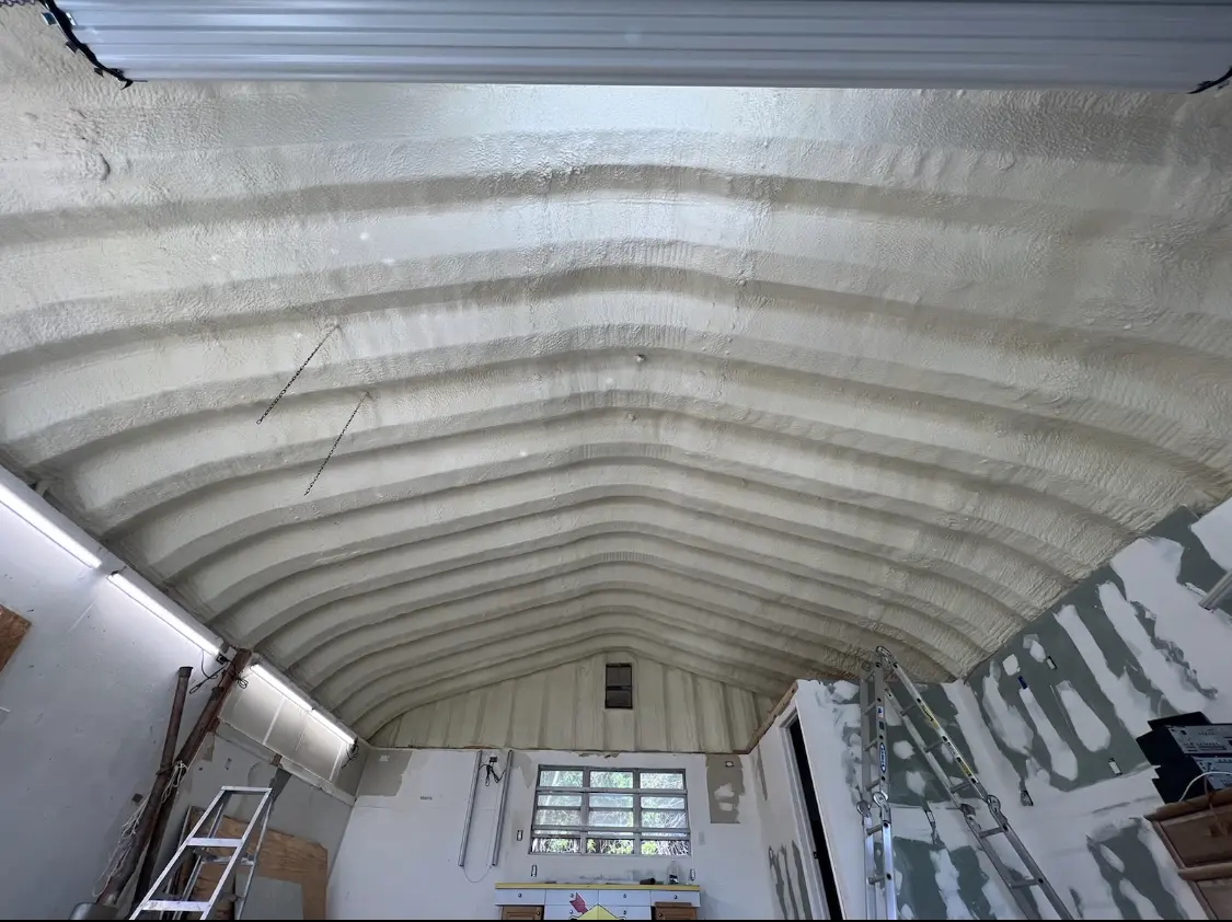 Spray polyurethane foam applied to the underside of a metal roof deck in Hibbing